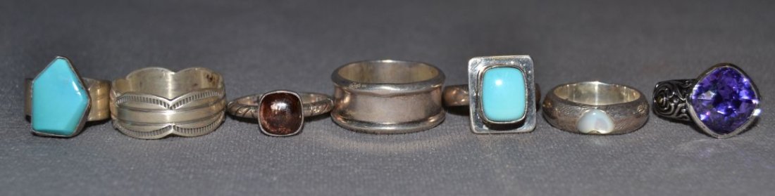 SIX SILVER RINGS: 1980s 90s sterling silver largest stamped design size 10 Shipping charge are for the United States. The shipping on this lot is $10.00. Outside the United States there will be additional shipping fees