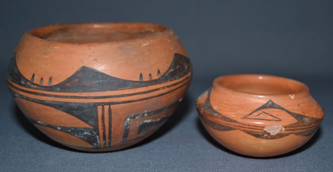 TWO HOPI POTS: 1960s 70s largest polychrome has surface wear and scratches 3"x4.75" smallest black on orange has spalding and chips 1.75"x3.5" Shipping charge are for the United States. The shipping on this lot is $