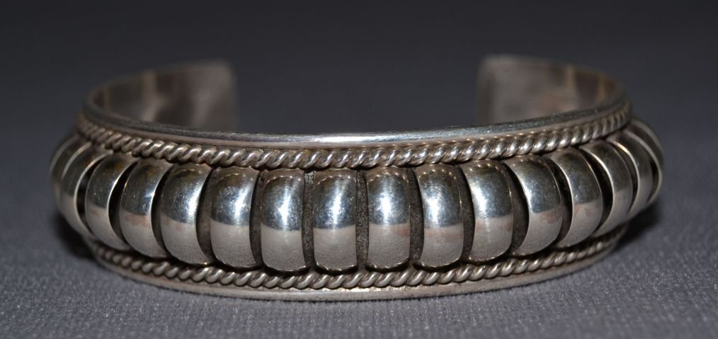 NAVAJO SILVER BRACELET: 1980 90s sterling silver unusual design signed PA 5.25"x.75"x1.25" Shipping charge are for the United States. The shipping on this lot is $10.00. Outside the United States there will be additional shi