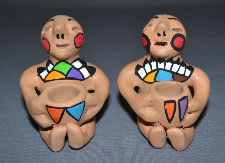 TWO TESUQUE RAIN GOD: 1980s 90s poster paint design minor rubs 3.75"x2.75"x3" each Shipping charge are for the continental United States only There will be additional shipping fees on shipments to Hawaii, Alaska and outsid