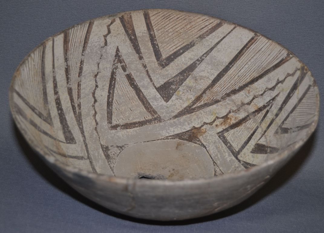 MIMBRES POTTERY BOWL: prehistoric black on white broken and glued fine line design minor paint loss has hole in bottom 5" x 11" Shipping charge are for the continental United States only There will be additional shipping f