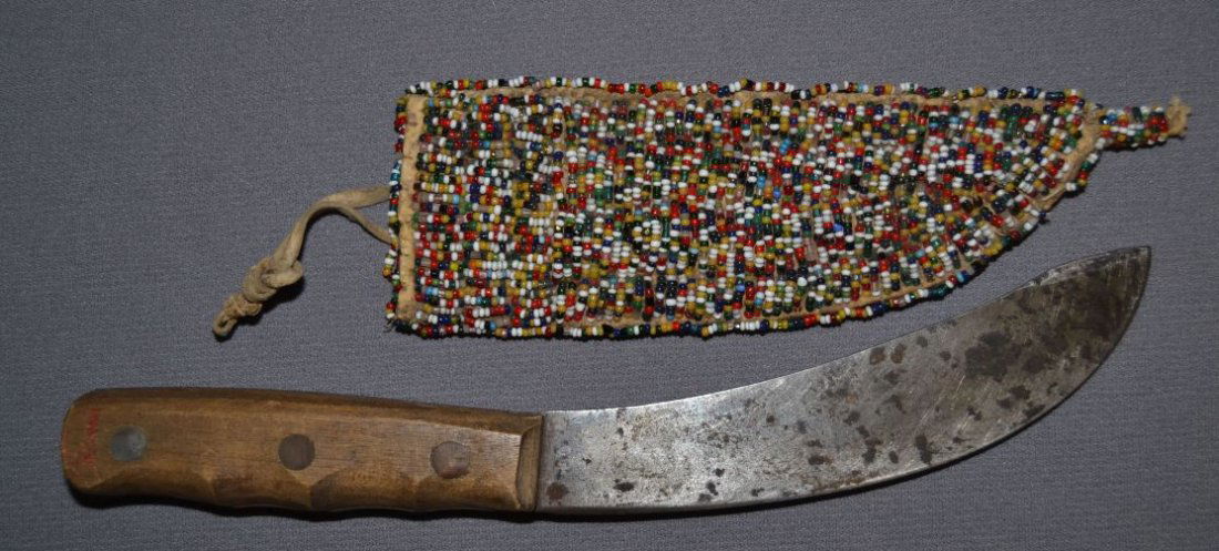 PLAINS INDIAN KNIFE AND SHEATH: 1900 1910 fully beaded front design on sheath 7.5"x2.5" knife 10.5"x1.25" Shipping charge are for the continental United States only There will be additional shipping fees on shipments to Hawaii, Alas
