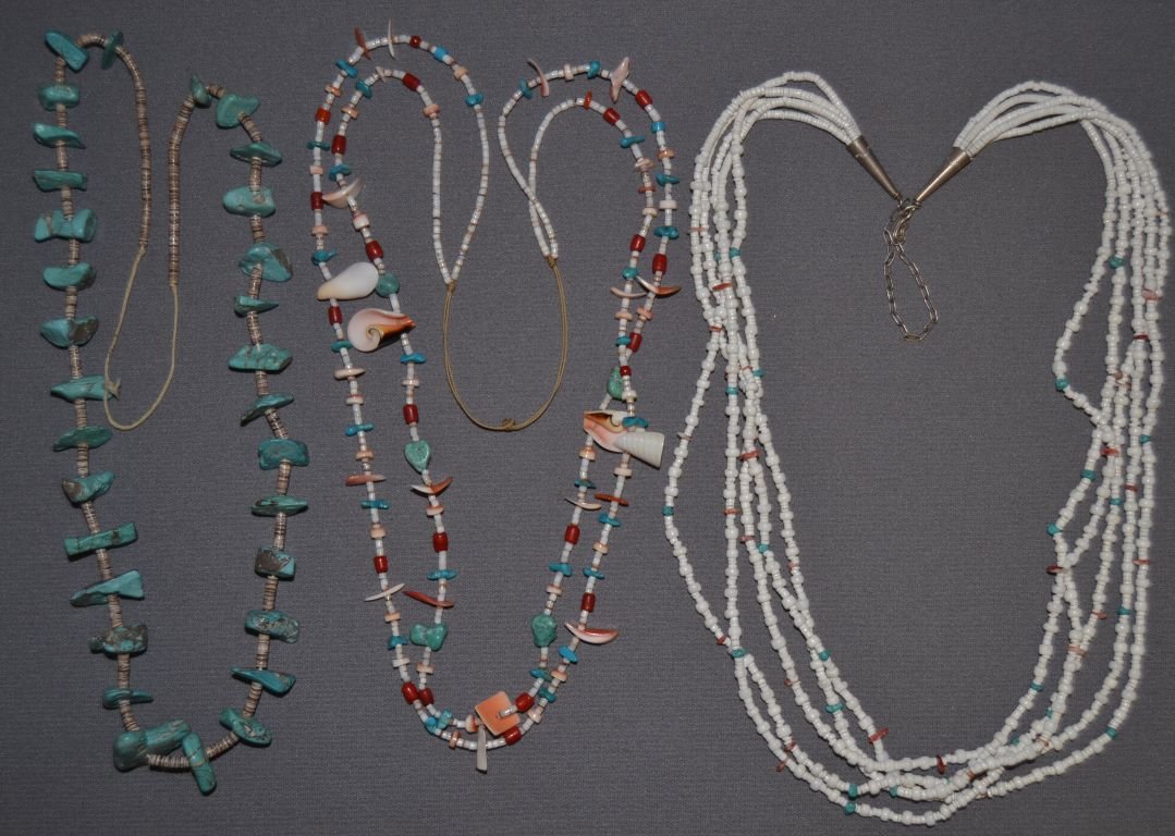 THREE PUEBLO NECKLACES: 1980s 90s all are approx. 30" long one 6 strands of shell coral and turqoiuse, one nugget turqouise and heishe, and two strands of shell coral and turqoiuse and heishe Shipping charge are for the cont