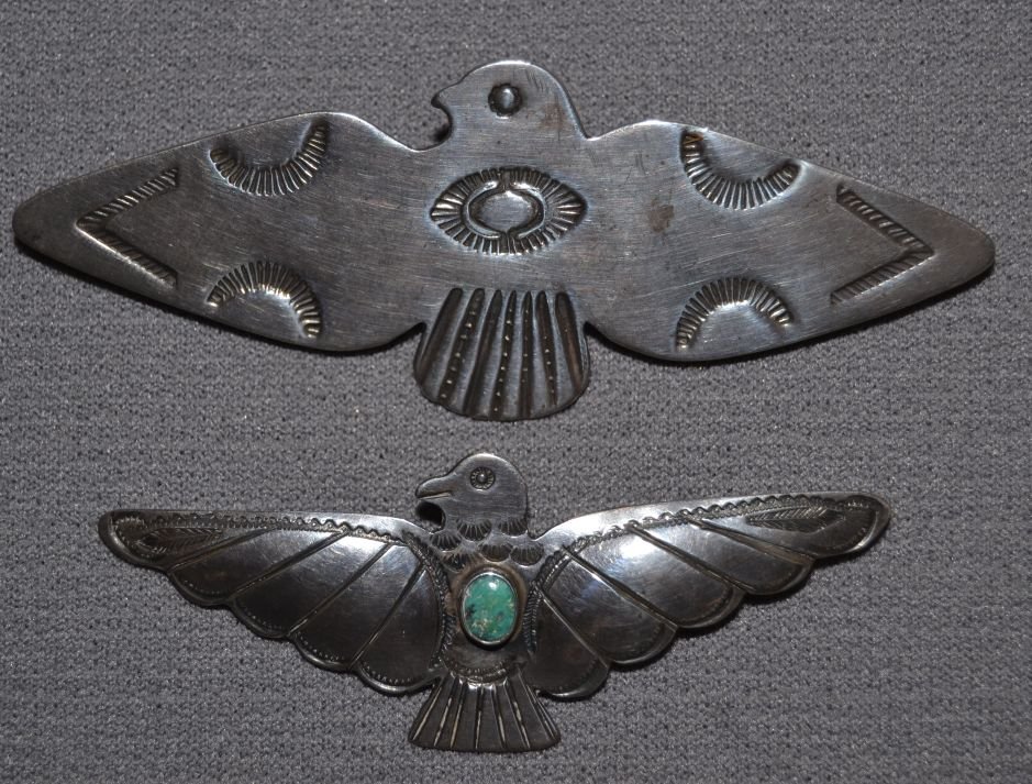 TWO NAVAJO PINS: 1950s 60s sterling silver stamped design largest marked RA 1.2"x3.25" smallest single turquoise stone 1"x2.25" Shipping charge are for the continental United States only There will be additional shipp