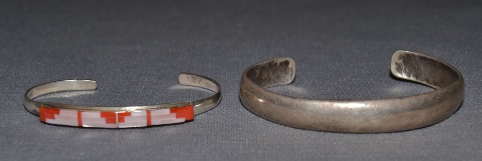 TWO SILVER BRACELETS: 1980s 90s sterling silver largest 5.75"x.25"x1.25" smallest stone to stone inlay 5.25"x.25"x11" Shipping charge are for the continental United States only There will be additional shipping fees on shi