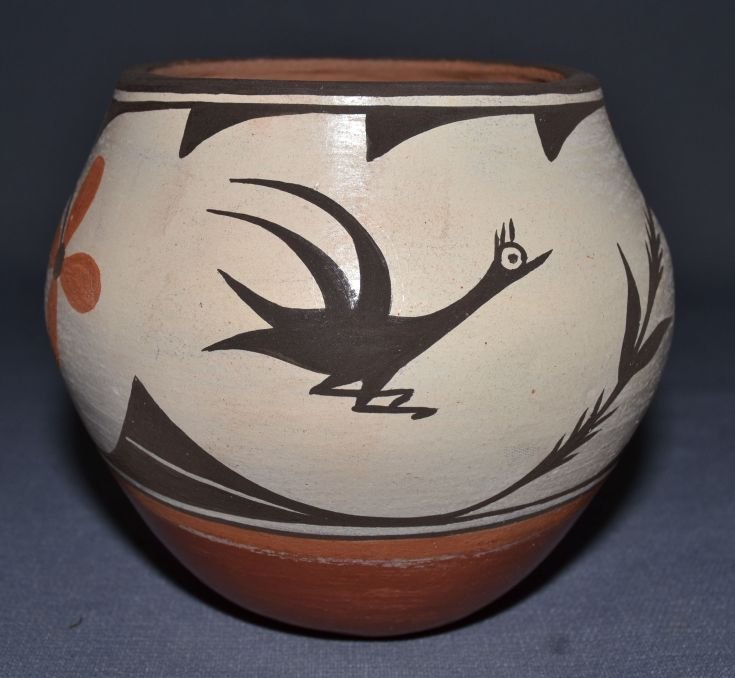 ZIA POTTERY JAR: 1980s 90s polychrome bird and floral design has minor pitting 5"x5.5" Shipping charge are for the continental United States only There will be additional shipping fees on shipments to Hawaii, Alaska a