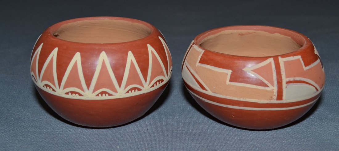 TWO SANTA CLARA POTTERY BOWLS: 1980s 90s red ware painted design largest signed Teresa 2.5"x3.75" smallest signed Marie both have minor surface scratches 2.5"x3.5" Shipping charge are for the continental United States only There wi
