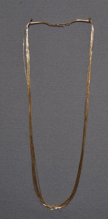 NAVAJO NECKLACE: 1980s 90s sterling silver gold plated 10 stands of liquid silver 21" long" Shipping charge are for the continental United States only There will be additional shipping fees on shipments to Hawaii, Ala