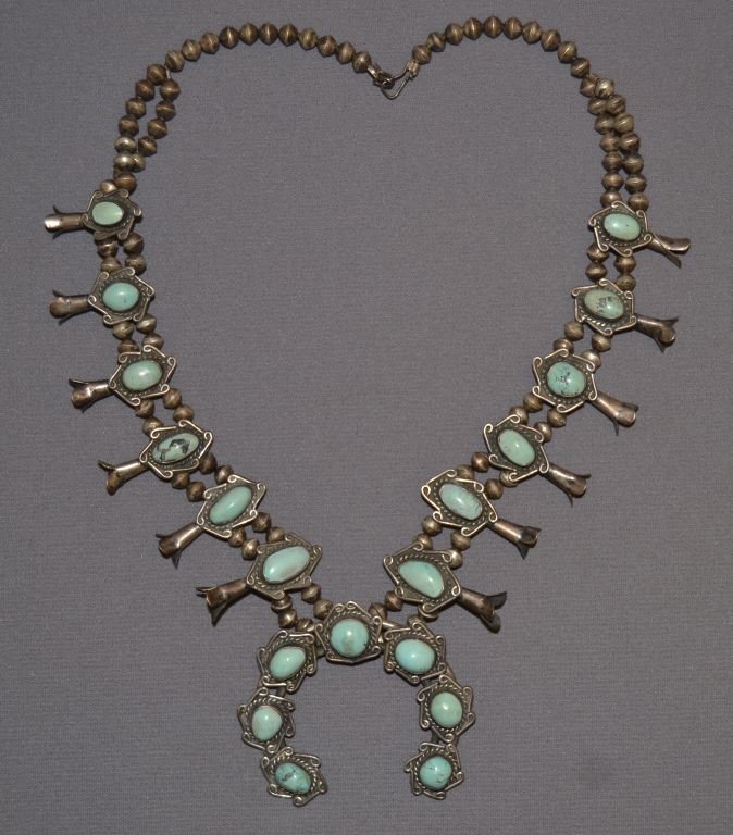 NAVAJO SQUASH BLOSSOM NECKLACE: 1960s 70s sterling silver and turquoise 21" long Shipping charge are for the continental United States only There will be additional shipping fees on shipments to Hawaii, Alaska and outside the United