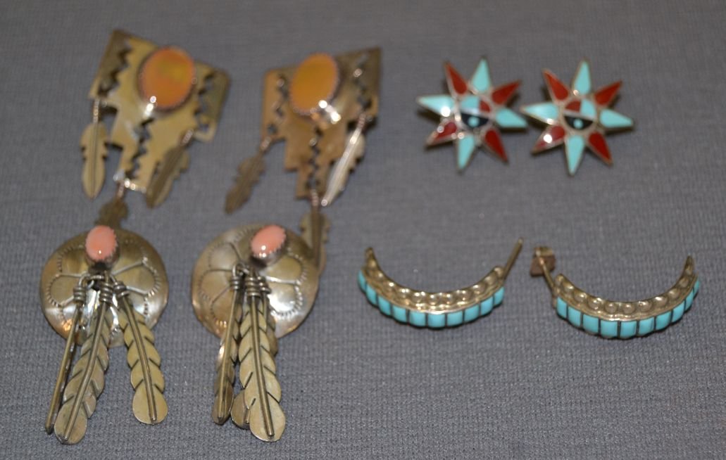 COLLECTION OF FOUR PAIRS OF NAVAJO EARRINGS: 1970s 80s sterling silver channel inlay star 1" diameter Shipping charge are for the continental United States only There will be additional shipping fees on shipments to Hawaii, Alaska and outside th