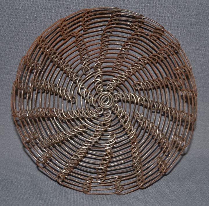 PIMA WIRE BASKET: 1960s 70s hand woven from baling wire 2"x8.25" Shipping charge are for the continental United States only There will be additional shipping fees on shipments to Hawaii, Alaska and outside the United S