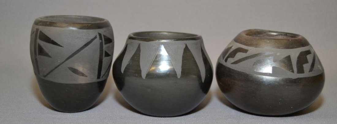 TWO SANTA CLARA AND ONE SAN ILDEFONSO POTTERY BOWLS: 1980s 90s matte on black San Ildefonso 2.75"x4" signed Lucy Martinez vase signed Marie 3.5"x2.75" bowl 3"x3.5" Shipping charge are for the continental United States only There will be additional shipp