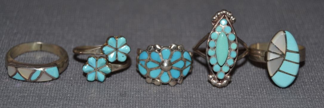 COLLECTION OF FIVE NAVAJO RINGS: 1970s 80s sterling silver and turquoise 2 have mother of pearl one signed RLL largest size 7.5 Shipping charge are for the continental United States only There will be additional shipping fees on ship