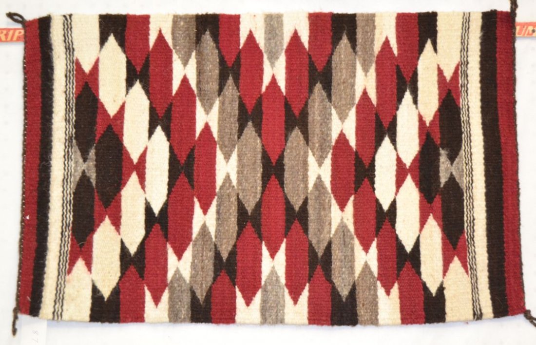 NAVAJO TEXTILE: contemporary gallup throw style attributed to Elizabeth Yazzie 29"x18" Shipping charge are for the continental United States only There will be additional shipping fees on shipments to Hawaii, Alaska 