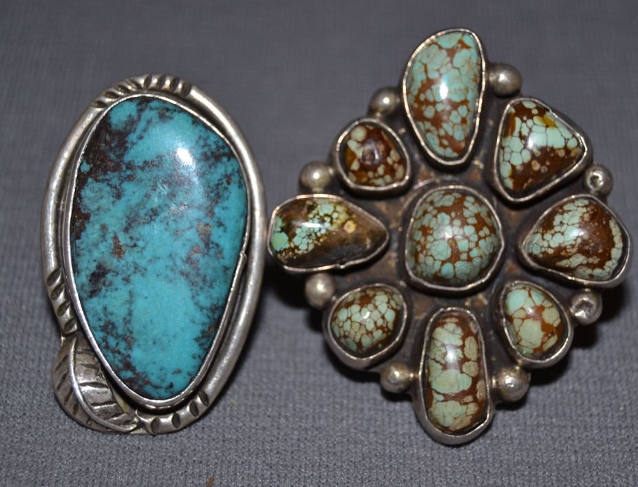 TWO LARGE NAVAJO SILVER RINGS: 1970s 80s sterling silver and turquoise largest cluster style size 8 smallest single turquoise stone signed with logo size 3 Shipping charge are for the continental United States only There will be ad