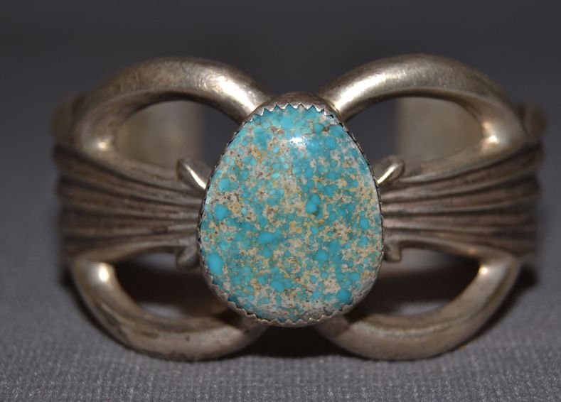 NAVAJO SILVER CHILDS BRACELET: 1970s 80s sterling silver sand cast design single turquoise stone signed ND 4.5"x1.25"x1" Shipping charge are for the continental United States only There will be additional shipping fees on shipments