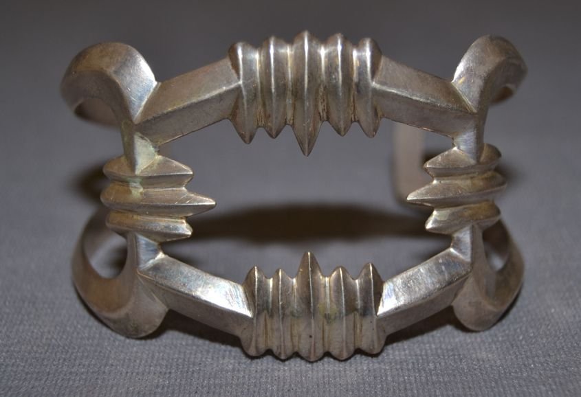 NAVAJO SILVER BRACELET: 1970s sand cast sterling silver 6.25"x1.8"x1.75" Shipping charge are for the continental United States only There will be additional shipping fees on shipments to Hawaii, Alaska and outside the United
