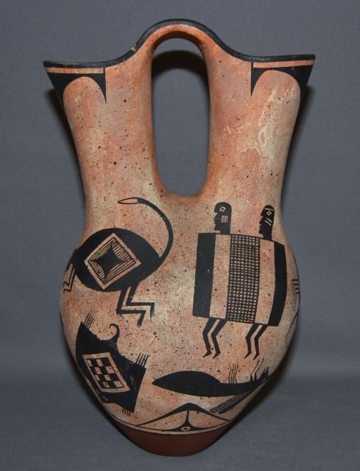 JEMEZ POTTERY WEDDING VASE: 1980s 90s black on tan animal design has minor paint loss signature has rubbing 14.5"x7" Shipping charge are for the continental United States only There will be additional shipping fees on shipments 