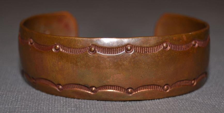 NAVAJO COPPER BRACELET: 1960s 70s hand stamped design 5.75"x.8"x1.25" Shipping charge are for the continental United States only There will be additional shipping fees on shipments to Hawaii, Alaska and outside the United St