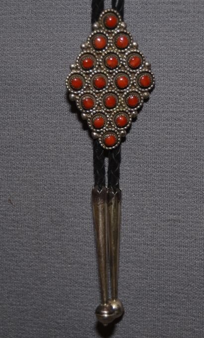NAVAJOS SILVER BOLO: 1970s 80s sterling silver and coral signed B. Natewa 2"x1.25" Shipping charge are for the continental United States only There will be additional shipping fees on shipments to Hawaii, Alaska and outsi