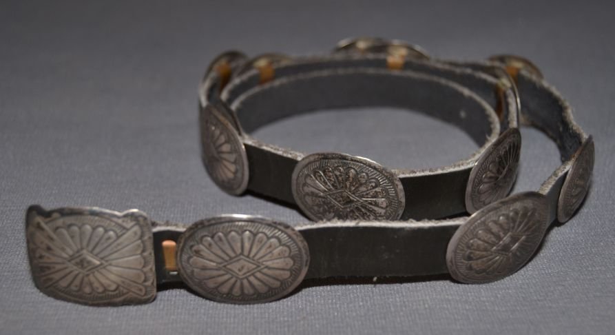 NAVAJO SILVER CONCHO BELT: 1960s 70s sterling silver stamped design buckle .75"x1"13 conchos .75"x1" signed RB 35" long Shipping charge are for the continental United States only There will be additional shipping fees on shipme