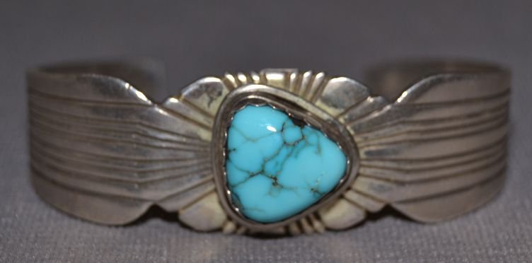 NAVAJO SILVER BRACELET: 1980s 90s sterling silver single turquoise stone signed L 5"x.75"x1" Shipping charge are for the continental United States only There will be additional shipping fees on shipments to Hawaii, Alaska an