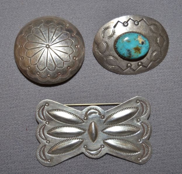 THREE NAVAJO SILVER PINS: 1960s 70s sterling silver stamped design single turquoise stone 1"x1.5" Shipping charge are for the continental United States only There will be additional shipping fees on shipments to Hawaii, Alaska
