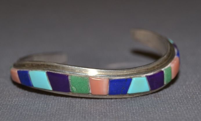 NAVAJO SILVER BRACELET: 1980s 90s sterling silver multi stone to stone inlay 4.75"x.25"x1" Shipping charge are for the continental United States only There will be additional shipping fees on shipments to Hawaii, Alaska and 