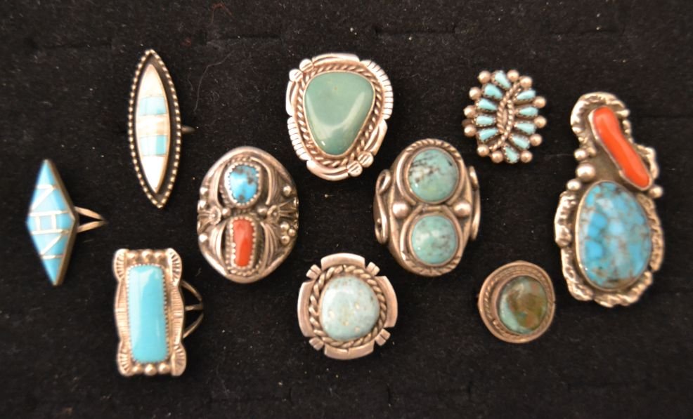 TEN NAVAJO SILVER RINGS: 1960s 70s sterling silver turquoise and coral largest size 12 one signed L size 10.5 one signed DC size 7.5 channel inlay signed LJ size 6 Shipping charge are for the continental United States only Th