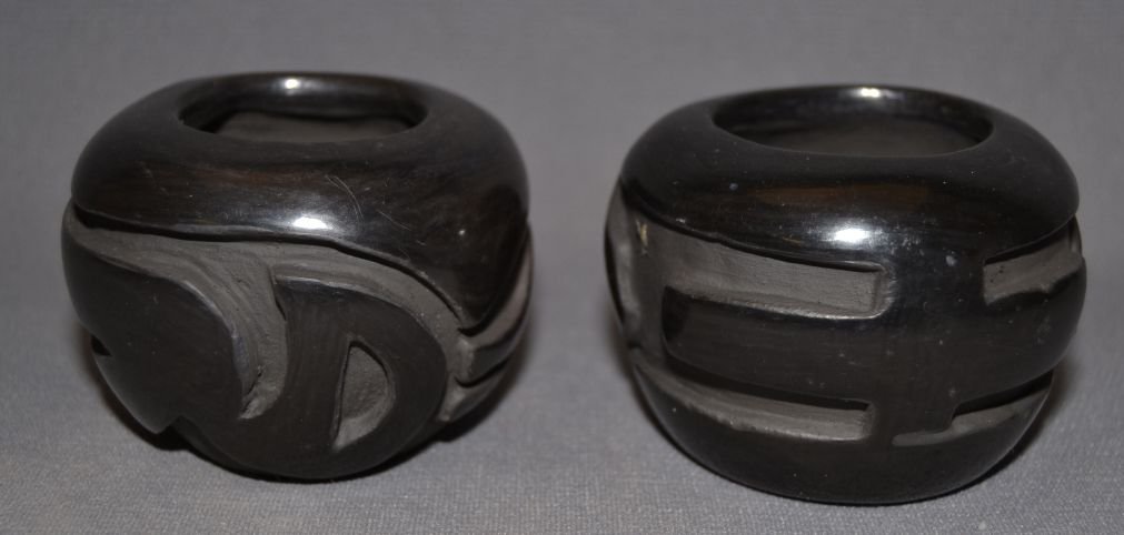 TWO SANTA CLARA POTTERY BOWLS: 1980s 90s carved black ware both are 2.25"x3" and signed Carmel Romero Shipping charge are for the continental United States only There will be additional shipping fees on shipments to Hawaii, Alaska 