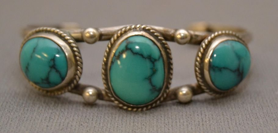 NAVAJO SILVER BRACELET: 1980s 90s sterling silver 3 turquoise stones 5"x.75"x1.25" Shipping charge are for the continental United States only There will be additional shipping fees on shipments to Hawaii, Alaska and outside 