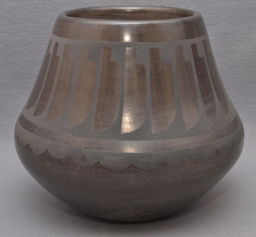 SAN ILDEFONSO POTTERY VASE: 1960s 70s matte on black feather design signed Carlos Dunlap 6"x6.75" Shipping charge are for the continental United States only There will be additional shipping fees on shipments to Hawaii, Alaska a