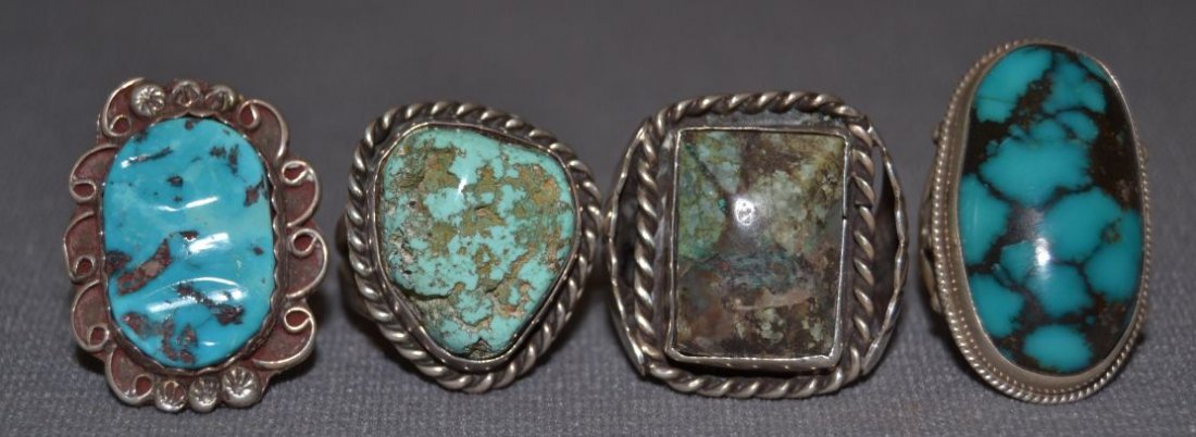 FOUR NAVAJO SILVER RINGS: 1960s 70s sterling silver and turquoise men's style largest size 10.25 Shipping charge are for the continental United States only There will be additional shipping fees on shipments to Hawaii, Alaska 