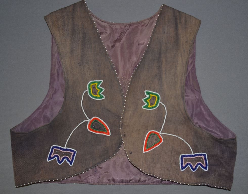 PLAINS BEADED VEST: 1940's child sized pictorial Eagle and floral design on cloth has minor bead loss and damage to trade cloth 14" x 16" Shipping charge are for the continental United States only There will be additiona