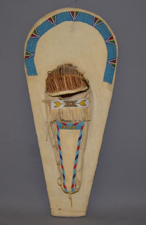PAIUTE CHILD'S TOY CRADLE: 1940's traditional beaded design on native tanned hide minor bead loss, 24" x 11" x 4" Shipping charge are for the continental United States only There will be additional shipping fees on shipments to