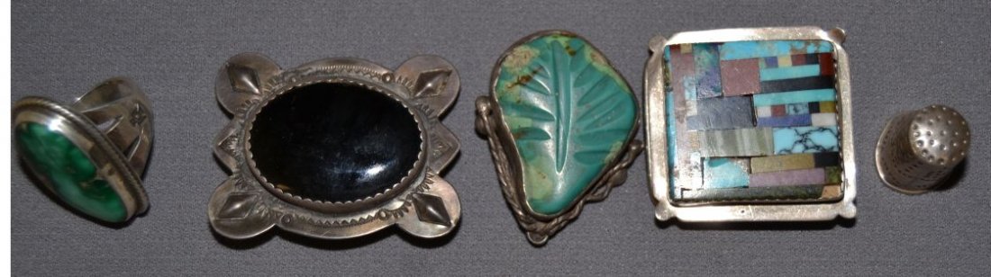FIVE NAVAJO JEWELRY ITEMS: 1960's 70's sterling silver and turquoise ring size 9.5, thimble 1" x.75",turquoise leaf pin 1.75" x 1.25",silver and jet bolo slide 1.75" x 2",silver with mosaic inlay buckle 1.75" x 1.75"made for 1"