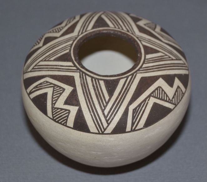 ACOMA POTTERY SEED JAR: 1960's fine line geometric design signed Lucy M Lewis, 3" x 4" Shipping charge are for the continental United States only There will be additional shipping fees on shipments to Hawaii, Alaska and outs