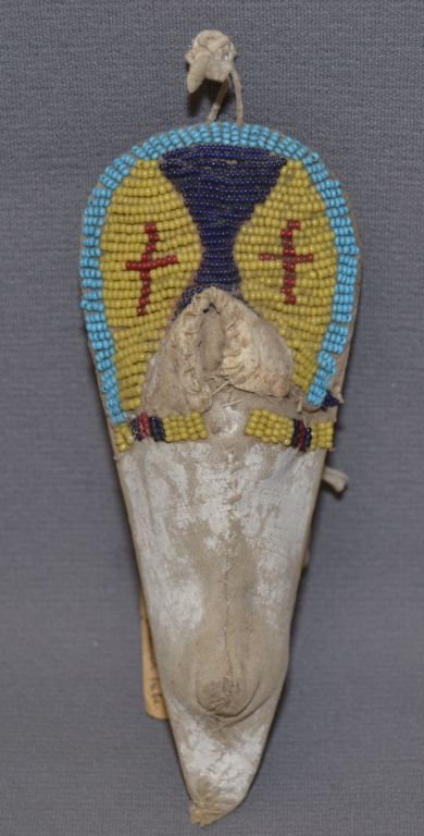 SHOSHONI MINI CRADLE: 1920's geometric beaded design on hide attached to cloth has minor bead loss, 6" x 2.5"x 1" Shipping charge are for the continental United States only There will be additional shipping fees on shipmen