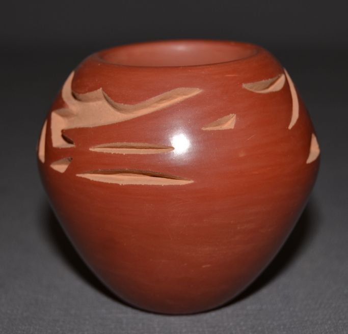 SANTA CLARA POTTERY JAR: 1980s 90s carved red ware design has minor surface scratches Bradford Martinez 3"x3.25" Shipping charge are for the continental United States only There will be additional shipping fees on shipments t