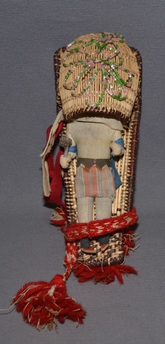 CALIFORNIA BASKETRY CRADLE BOARD: 1950s 60s hand woven with beaded design and hand made doll 8.5"x3.5"x3" Shipping charge are for the continental United States only There will be additional shipping fees on shipments to Hawaii, Alaska