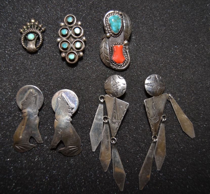 FIVE NAVAJO SILVER ITEMS: 1960s 80s sterling silver 2 pair of earrings largest 3"x1" 2 rings largest size 9.5 smallest size 6.5 one single screw back earring Shipping charge are for the continental United States only There wil