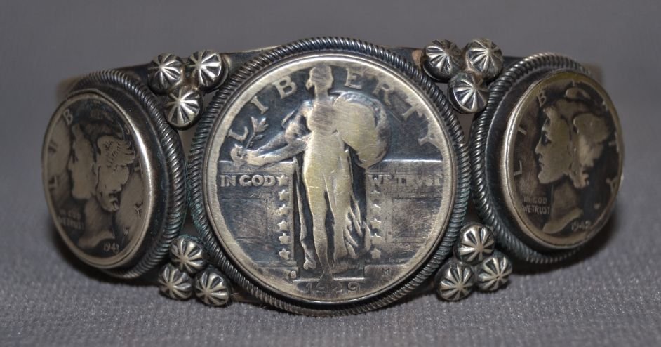NAVAJO SILVER BRACELET: 1980s 90s sterling silver with coin design signed Paul Stungs 5.5"x1"x1" Shipping charge are for the continental United States only There will be additional shipping fees on shipments to Hawaii, Alask