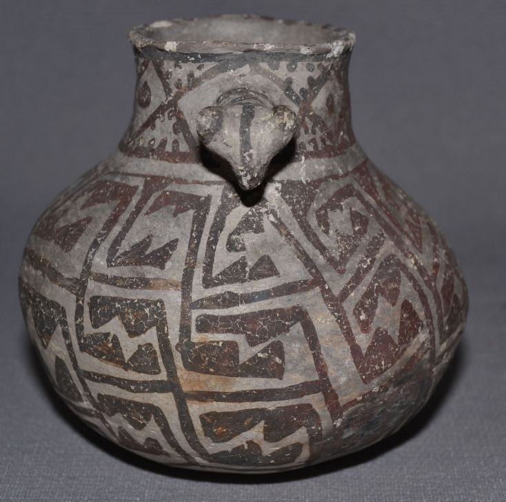 ANASAZI POTTERY CANTEEN: prehistoric black on white childs size with animal head handle as found condition minor chips on rim 3.75"x4" Shipping charge are for the continental United States only There will be additional shippi