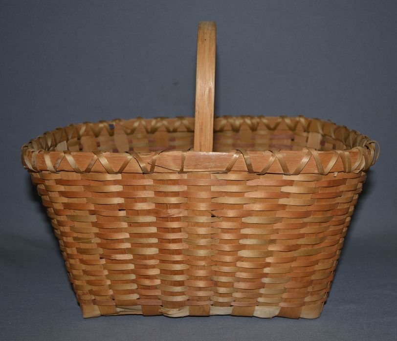 WINNEBAGO BASKET: 1940s 50s hand woven faded on outside minor stitch loss market style basket 13"x 15.25"x 10.5" Shipping charge are for the continental United States only There will be additional shipping fees on ship