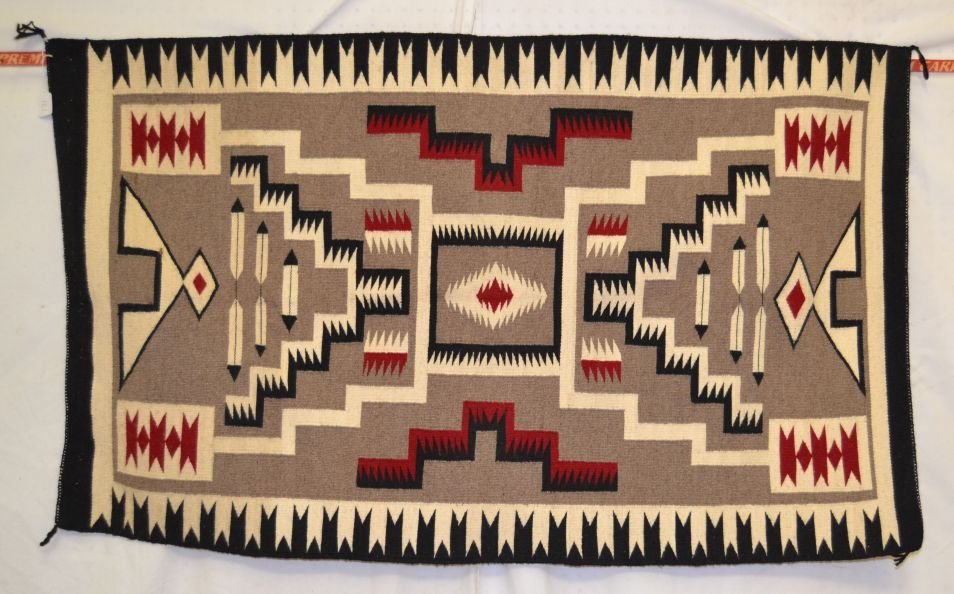 NAVAJO TEXTILE: 1970's storm pattern with feathers 54" x 33" Shipping charge are for the continental United States only There will be additional shipping fees on shipments to Hawaii, Alaska and outside the United Sta