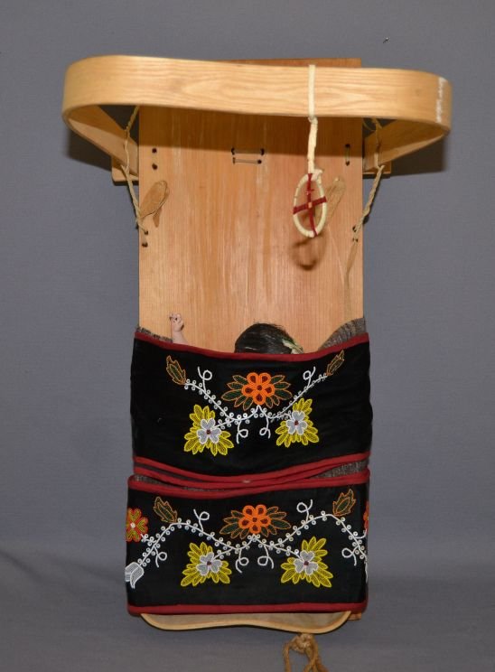 OJIBWA CRADLE BOARD: 1950's wooden board with beaded strip and doll 28" x 18" x 14" Shipping charge are for the continental United States only There will be additional shipping fees on shipments to Hawaii, Alaska and outs