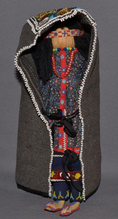 IROQUOIS DOLL AND CRADLE: 1950's beaded doll wearing traditional dress and cradle , 12'' tall Shipping charge are for the continental United States only There will be additional shipping fees on shipments to Hawaii, Alaska and