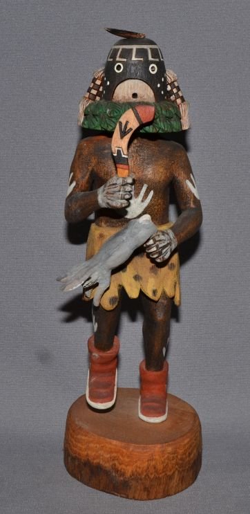 HOPI KACHINA: 1980's hand carved and painted cotton wood, depicting rabbit hunter, signed Franklin Sahmea, 11'' tall, rabbit has been glued Shipping charge are for the continental United States only There will be a