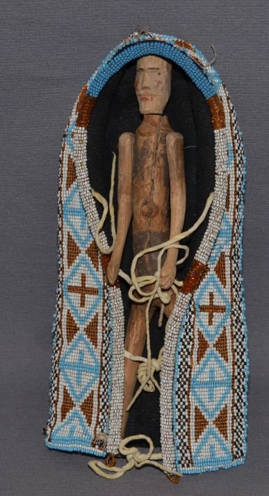 GREAT LAKES TOY BEADED CRADLE: 1920-30s loom beaded, some bead loss, with stick figure, 9.5" x 4.5" x 1.5" Shipping charge are for the continental United States only There will be additional shipping fees on shipments to Hawaii, Al
