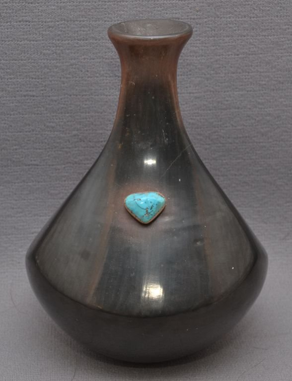 SAN ILDEFONSO POTTERY VASE: 1970-80s brown sepia around neck, single turquoise stone has crack, signed with logo, for Tsepe Gonzales, 6.5" x 5" Shipping charge are for the continental United States only There will be additional